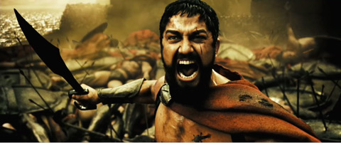 King Leonidas roars at the enemy in front of his dead men.