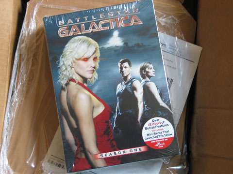 Newly opened Amazon box, containing BSG season 1 DVDs