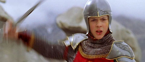 Edmund, in chain mail, swinging his sword, looking determined.