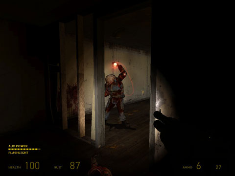A zombine soldier hoisting an armed grenade over its head, as seen through a door in a dark room.
