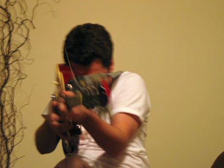 Brian literally weilds his guitar like a gun
