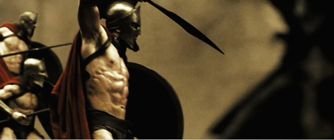Leonidas brings his sword up to meet charging oncoming enemy soldiers.