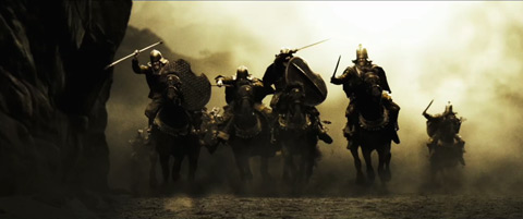 Persian horsemen charge towards the camera.
