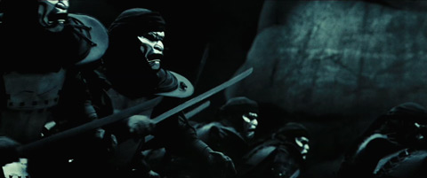 The Immortals charge towards the Spartans, swords out.