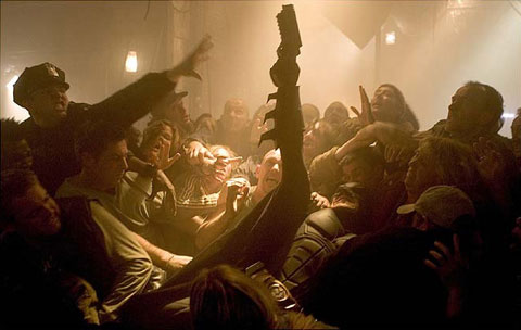 Batman is overtaken by an enraged mob