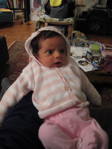 Blackbird wearing her pink and white hoodie, looking concerned.