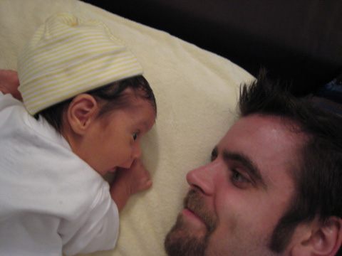 Blackbird and I look at each other during her tummy time.