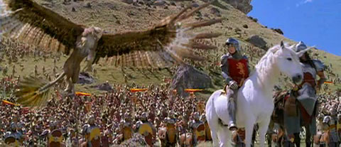 A gryffon lands behind Peter, who's in front of the army of good.