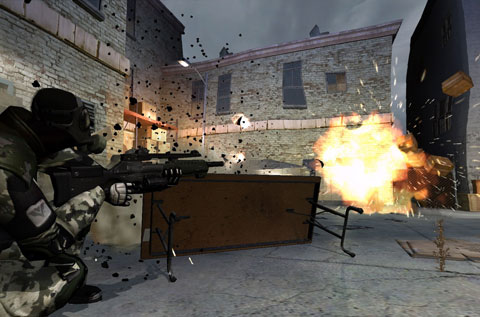 An explosion flings boxes around as a clone troop squats behind an overturned table.