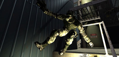 A clone troop leaps over a handrail off a raised level, lit by muzzle flare.