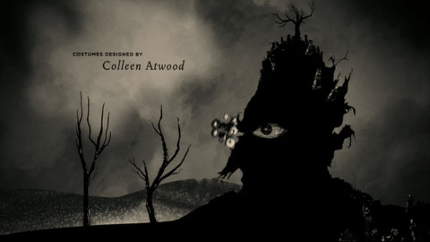 In front of a dark cloudy sky, the children ride a bicycle down a hill which bears a striking resemblance to Count Olaf's head in silhouette towards two trees that look eerily like hands.