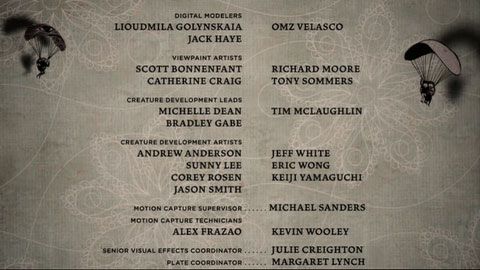 The end credits scroll over a pale faded curly star pattern on the same dirty wallpaper. The children parachute down by the credits, casting shadows on the patterned wall behind them.