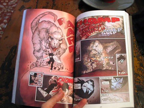 A fully colored spread from 'Hell and Back', showing a hallucination of a tyrannosaurus rex attacking the protagonist.