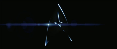 Star Trek boomerang logo, fading in on black, with a lens flare forming.